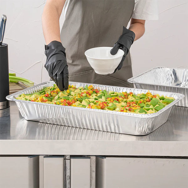 Multiple aluminum baking pans stacked