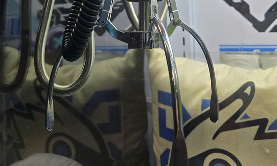Close-up of claw mechanism and prize compartment